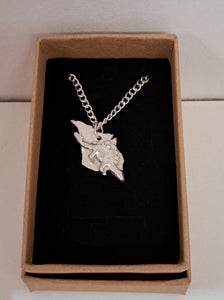 Silver Isle of Wight necklace featuring a dinosaur